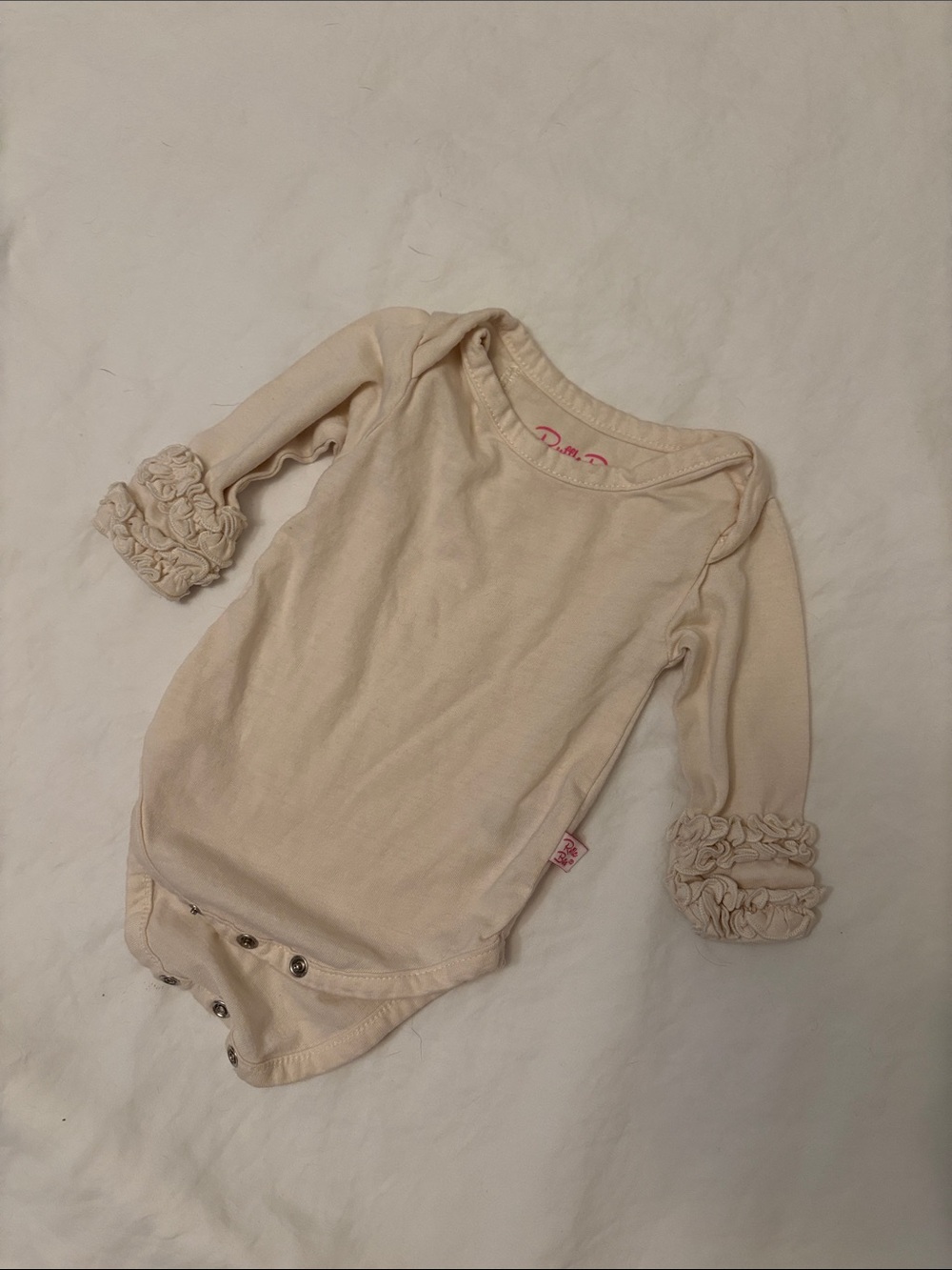 Ruffle Butts Cream Long-Sleeve Ruffle Cuff Bodysuit